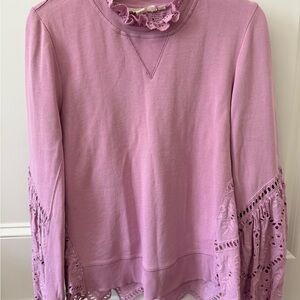 Light Purple top with eyelet sleeves and back. Thin sweatshirt material on front